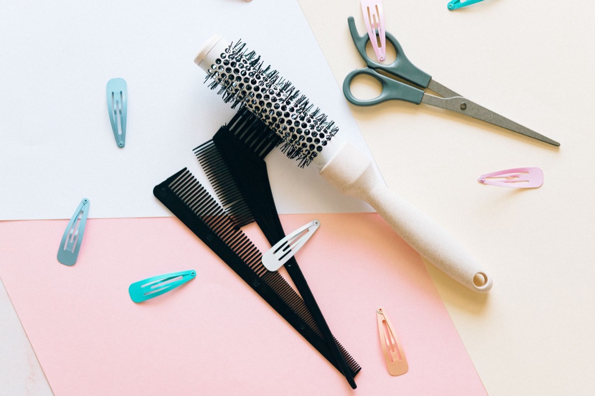 Close up of professional hair salon scissors and comb.